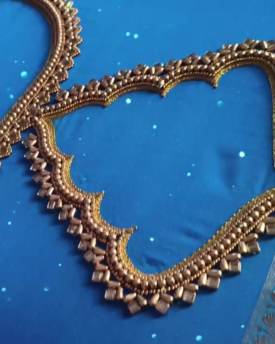 Blue Kanchipuram silk bridal blouse with gold kundan and bead neckline, aari work by Aari Petals by Nitha Coimbatore